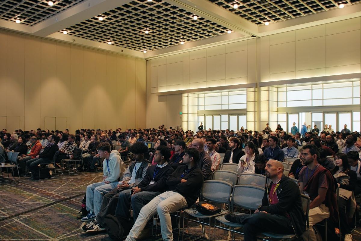 A packed conference hall of attendees at LA Tech Community's DevFest 2025