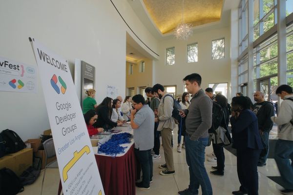 Attendees lining up at the DevFest 2025 registration table